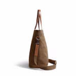 Side profile of biscuit tan canvas Buoy tote bag showing leather handle | KlippiK Middle East
