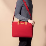 Detachable shoulder strap detail on crimson red Fleet messenger bag | KlippiK Kuwait