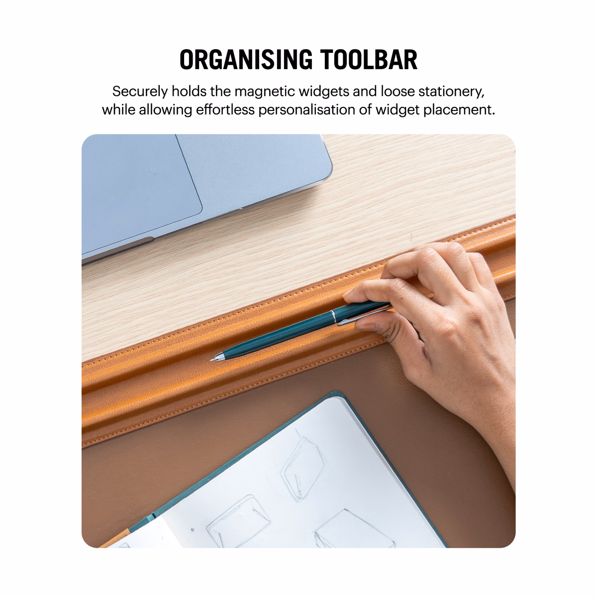 Tan-Brown Snap On Organiser Desk Mat with Cable Holder + Phone Mount + Apple Watch Charging Stand in Tan – Overhead view of hand holding pen on desk mat | KlippiK