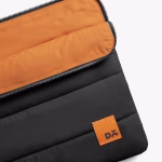 Close up of black Stria sleeve open top showing orange interior fabric | KlippiK Middle East