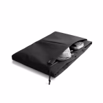 Top down view of black laptop sleeve with MacBook charger inside front pocket | KlippiK Middle East