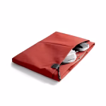 Top down view of coral laptop sleeve with MacBook charger inside | KlippiK Kuwait