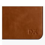 Corner detail of the tan vegan leather side with the debossed DailyObjects logo