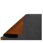Corner of the grey Turf 2.0 mat folded back to reveal the tan vegan leather reverse
