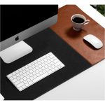 Turf 2.0 desk mat in grey set up under an iMac with keyboard, mouse and a coffee cup