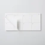 Top-down view of the Roda Week Pad with one weekly sheet lifting away from the block