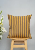 Sand Dunes 100% Cotton Geometric Cushion Cover For Sofa - Mustard and Brown by Yellow Dwelling, styled on a light wood stool against a pale wall