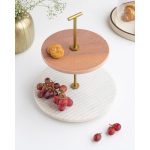Two-tier platter with a white marble base, wood upper tier and brass centre post, styled with fruit