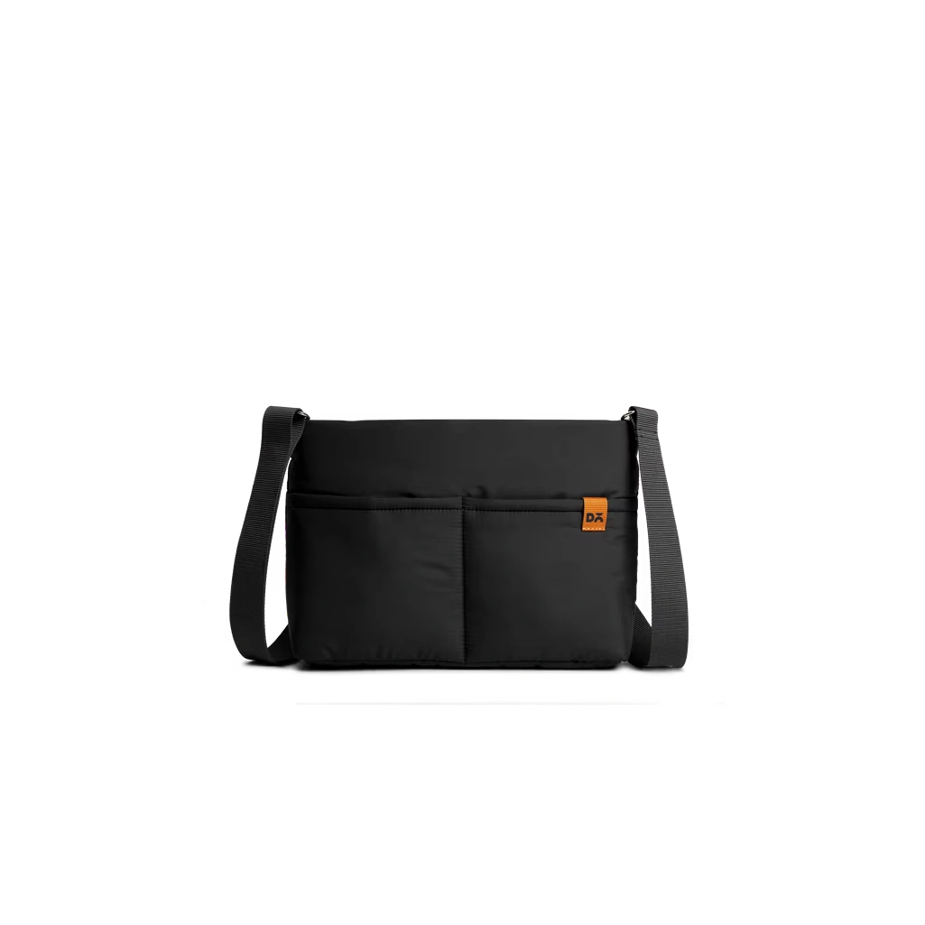 Carbon-Black-Retreat-Crossbody-Bag Carbon Black Retreat Crossbody Bag — compact crossbody with a webbing strap, shown on white