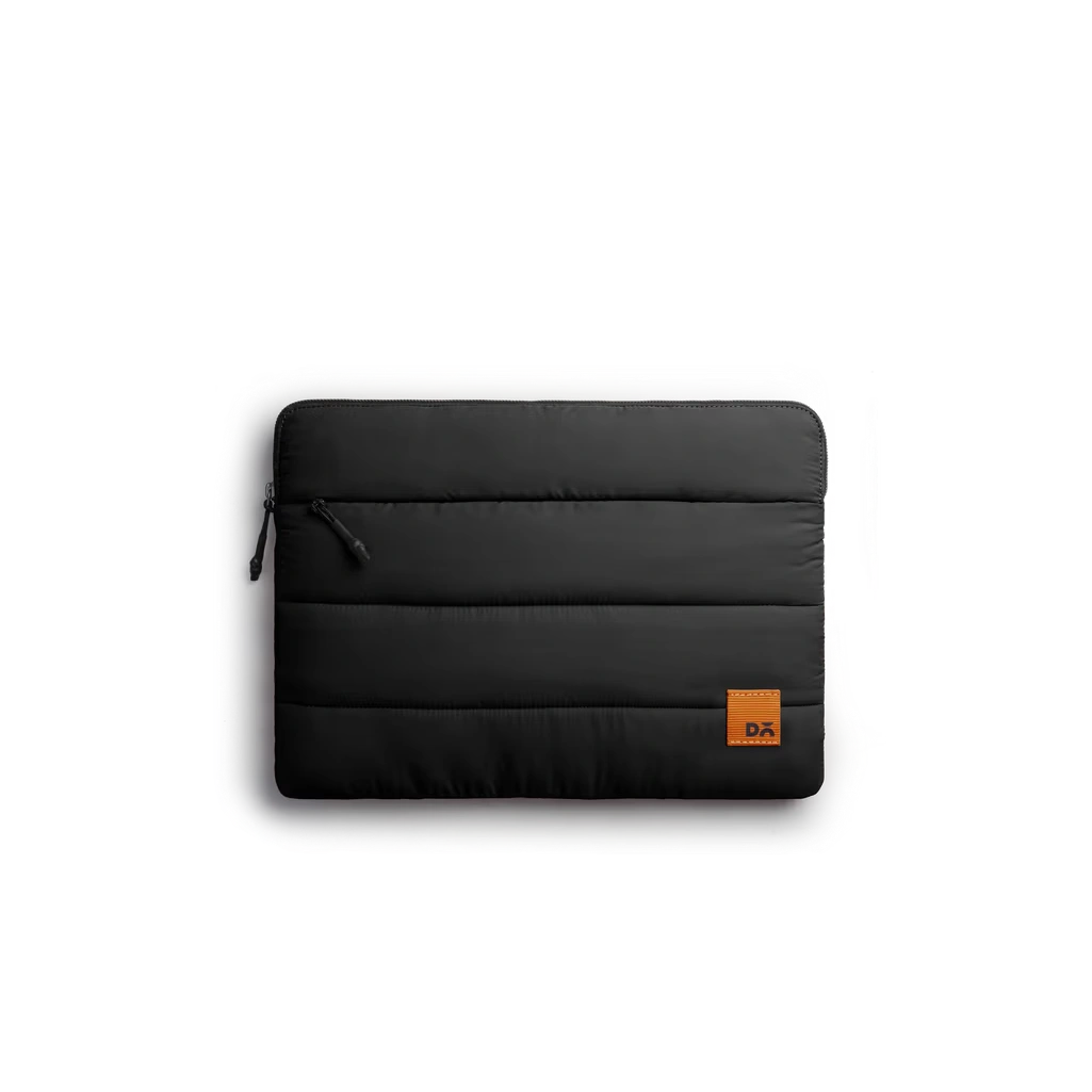 Carbon-Black-Stria-Laptop-Sleeve-Medium Carbon Black Stria Laptop Sleeve Bag - Medium — padded quilted laptop sleeve with a side carry handle, shown on white