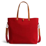 Crimson Red Buoy Tote Bag in red canvas with tan leather handles and a detachable shoulder strap
