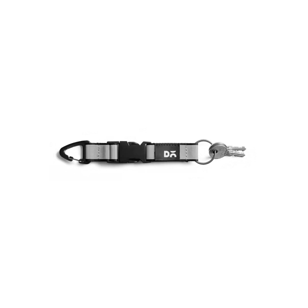 Light-Grey-Flint-Keychain Light Grey Flint Keychain laid flat on white — webbing strap with a metal clip and D-ring