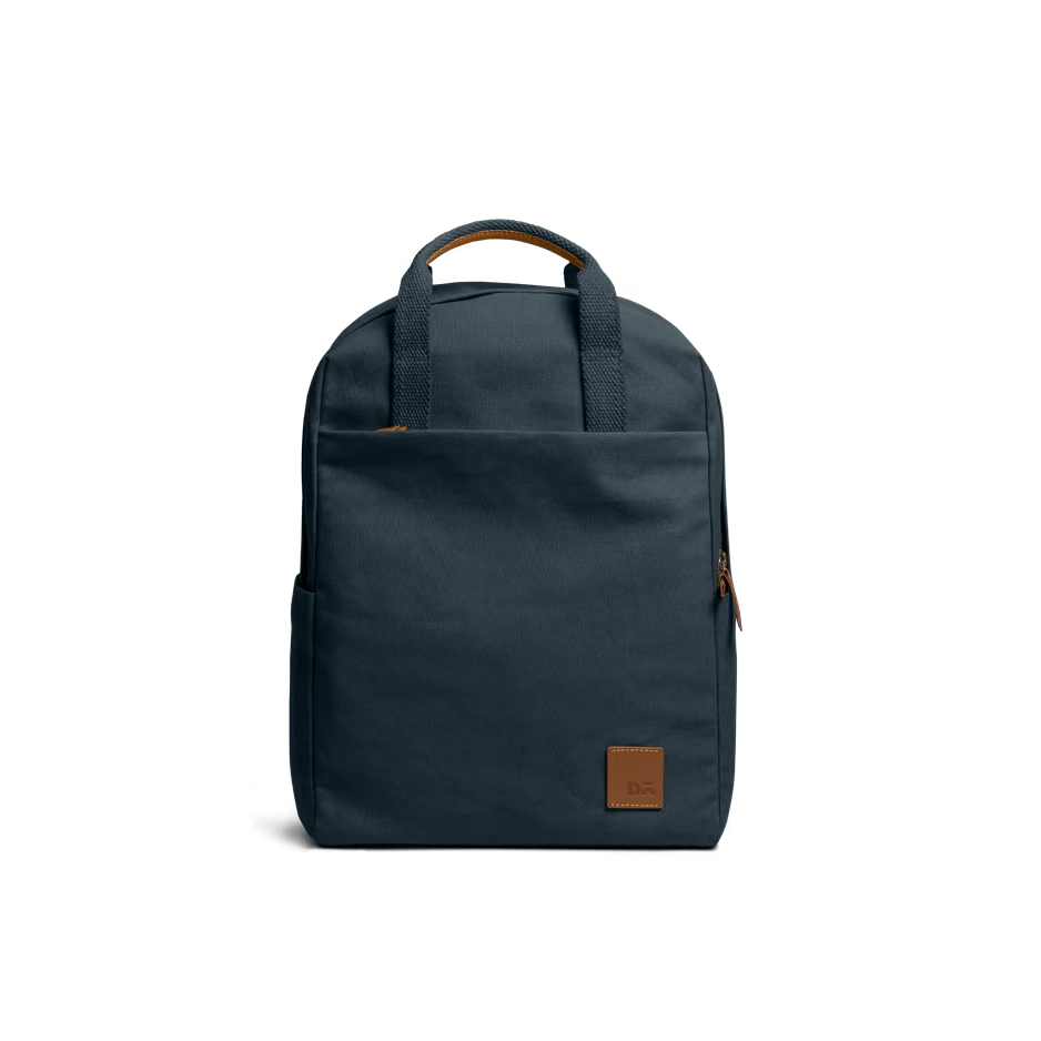 Navy-Field-Daypack-vw Navy Field Daypack — canvas daypack with a top handle and leather logo patch, shown on white