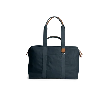 Navy Field Duffle Bag — canvas duffle with leather trim and twin handles, shown on white