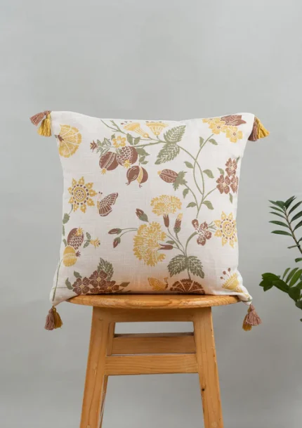 Waltz Printed Floral Pattern 100% Cotton Cushion Cover for Sofa with Tassels - Multicolor by Yellow Dwelling, styled on a light wood stool against a pale wall