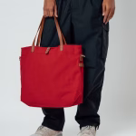 Lifestyle shot of crimson red canvas Buoy tote bag | KlippiK Worldwide