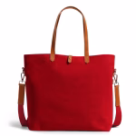 Angled view of crimson red Buoy tote bag with shoulder strap extended | KlippiK Worldwide