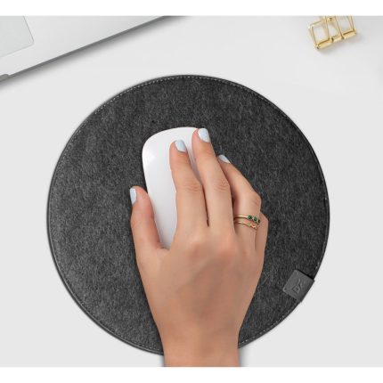 Hand moving a mouse across the round Orb Felt Duo mouse pad in charcoal felt
