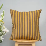 Sand Dunes 100% Cotton Geometric Cushion Cover For Sofa - Mustard and Brown by Yellow Dwelling, styled on a light wood stool against a pale wall