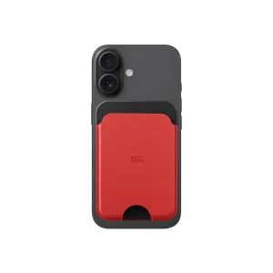 Crimson-Grey Leather MagSafe Card Wallet attached to the back of a black iPhone, shown on white