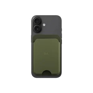 Green-Olive Leather MagSafe Card Wallet attached to the back of a black iPhone, shown on white