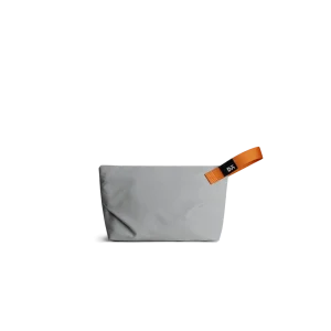 Light Grey Flash Pouch Bag — small zip pouch with a leather pull, shown on white