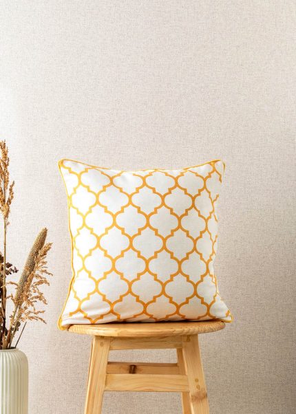 Moroccan Trellis 100% Cotton Geometric Cushion Cover For Sofa - Mustard by Yellow Dwelling, styled on a light wood stool against a pale wall