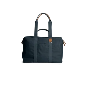 Navy Field Duffle Bag — canvas duffle with leather trim and twin handles, shown on white