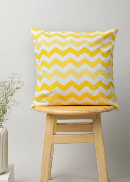 Ombre Chevron Cotton Cushion Cover - Yellow by Yellow Dwelling, styled on a light wood stool against a pale wall