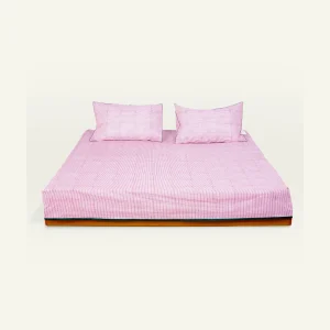 Berry Pink with Pearl Green Pure Stripes Flat Bedsheet shown made up on a low wooden platform bed with two matching pillows