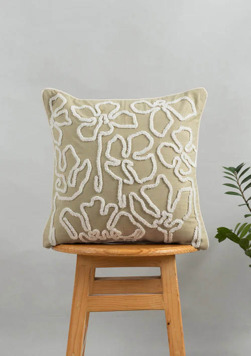 Stella_2 Stella Embroidered Flower Pattern 100% Cotton Cushion Cover for Sofa - Herb Green by Yellow Dwelling, styled on a light wood stool against a pale wall