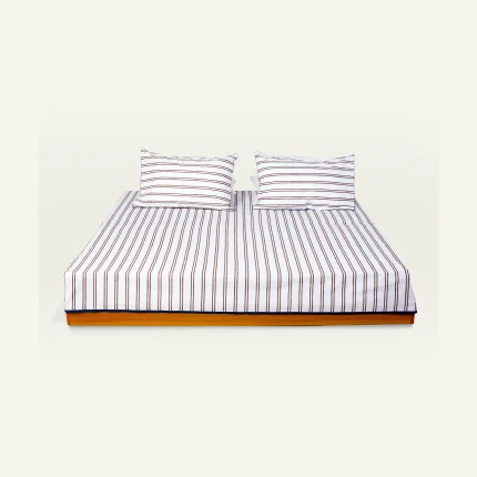 Mocha Brown with Haze Indigo Muted Layers Flat Bedsheet shown made up on a low wooden platform bed with two matching pillows