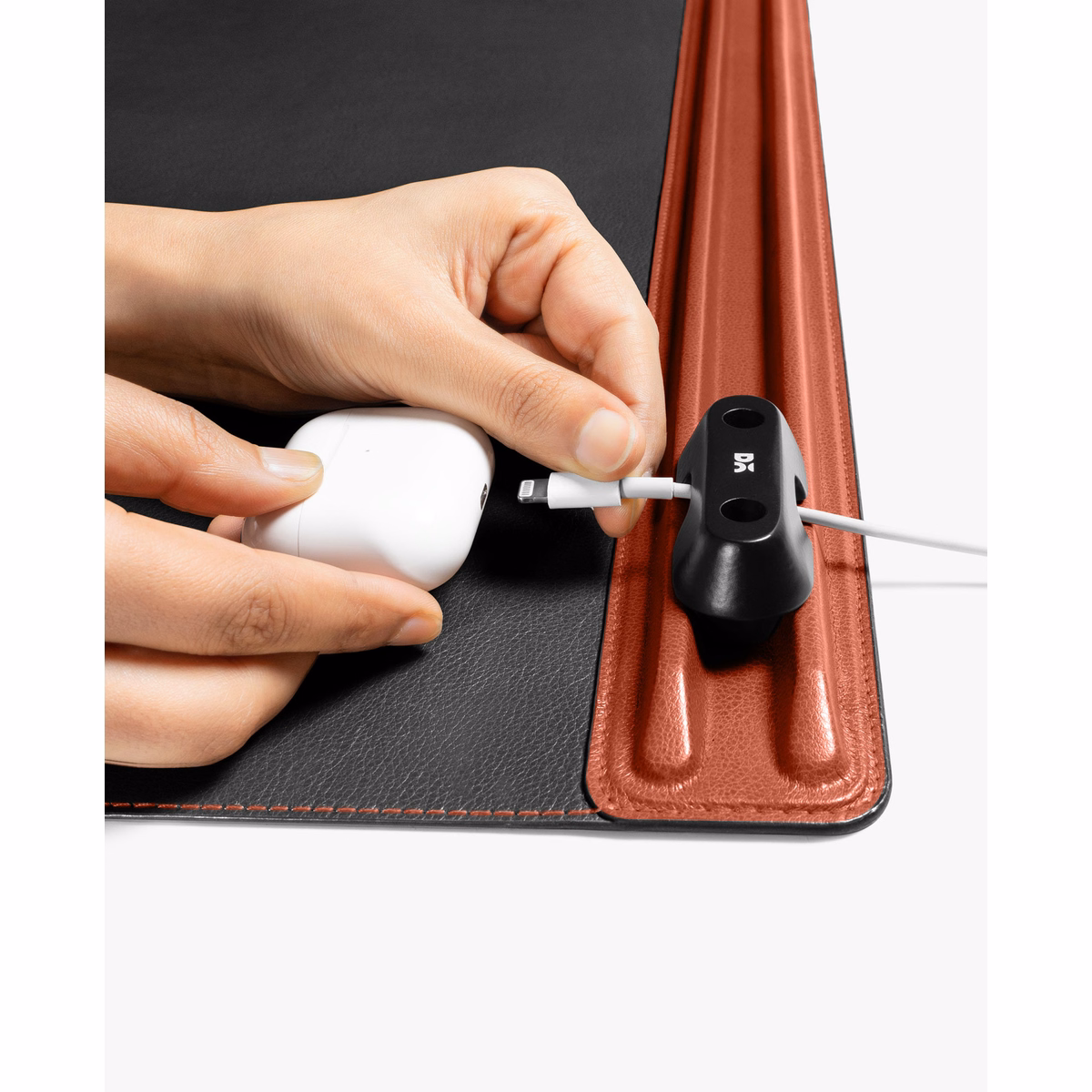 Red-Black Snap On Organiser Desk Mat with Cable Holder + Phone Mount + Apple Watch Charging Stand in Black – Close-up of Mat with Cable Holder and Accessories | KlippiK