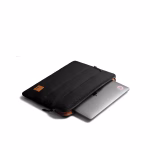 MacBook sliding out of black puffy sleeve revealing bright orange lining | KlippiK Kuwait