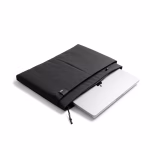 Angled view of MacBook sliding out of black ripstop laptop sleeve | KlippiK Kuwait