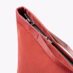 Detail view of coral pouch elastic top closure with zipper pull | KlippiK Kuwait
