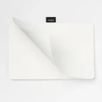Roda Notepad with its top pages curling open to reveal the dot grid interior