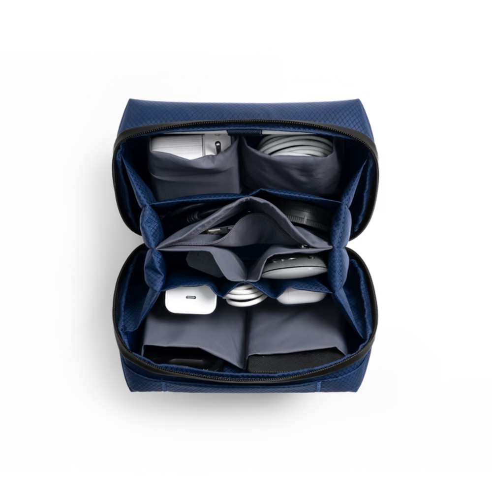 1 Blue Ripstop Vault Tech Organiser opened flat with chargers, AirPods and a mouse held in its elastic loops