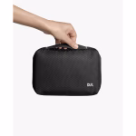 Black Ripstop Vault Tech Organiser - Medium in Black – Hand holding textured pouch with logo | KlippiK