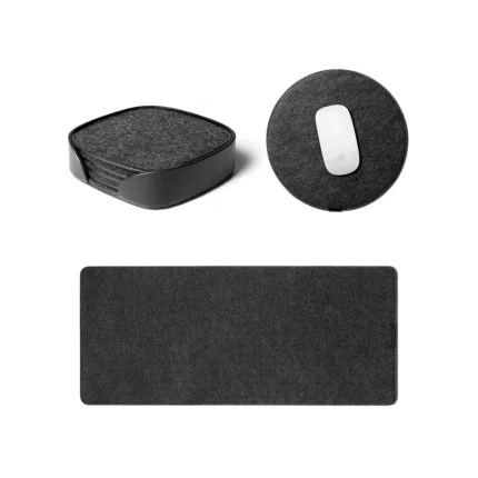 Felt Desk Trio Bundle in black — desk mat, round mouse pad and felt coasters laid out on white