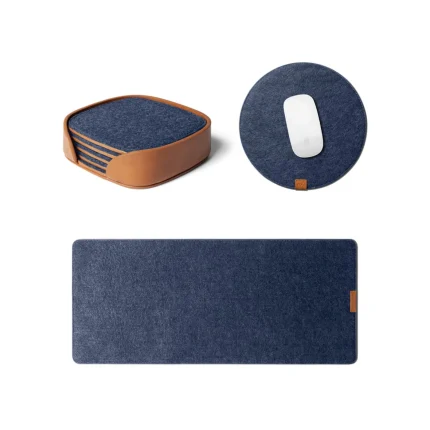Felt Desk Trio Bundle in blue — navy desk mat, round mouse pad and coaster set laid out on white