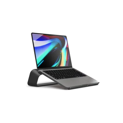 Arete Laptop Stand in black raising an open laptop to a typing angle, shown on white