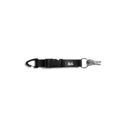 Dark Grey Flint Keychain laid flat on white — webbing strap with a metal clip and D-ring