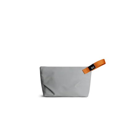 Light Grey Flash Pouch Bag — small zip pouch with a leather pull, shown on white