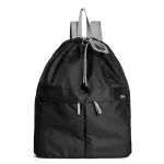 Carbon Black Way Backpack with a drawstring roll top and slim straps, shown on white